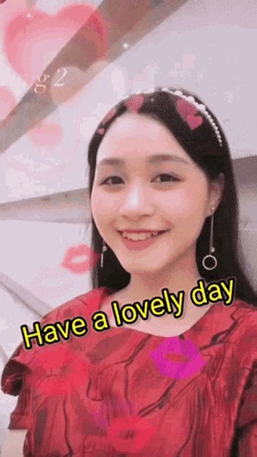 a woman in a red dress with the words have a lovely day