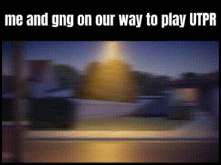 a blurred image of a street with the words me and gng on our way to play utpr