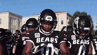 a group of football players wearing bears jerseys