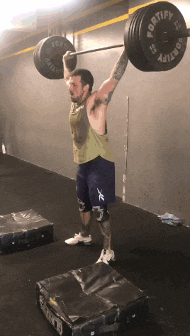 a man is lifting a barbell with a fortify barbell on it