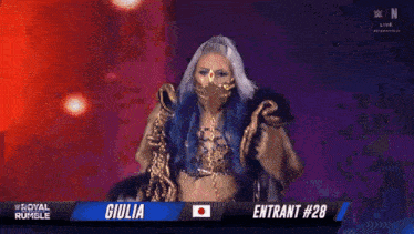 a woman with blue hair and a mask is standing on a stage in front of a sign that says giulia entrant # 28