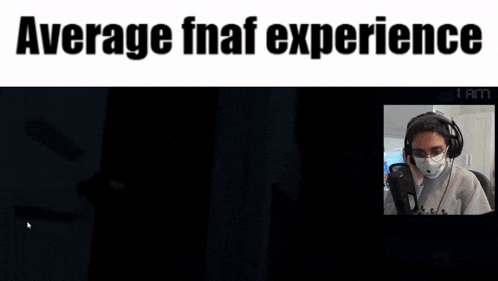 a man wearing headphones and a face mask is playing a video game called fnaf