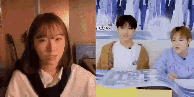 a girl and a boy are sitting next to each other in front of a poster .