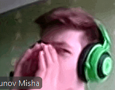 a man wearing green headphones with the name unov misha on the bottom