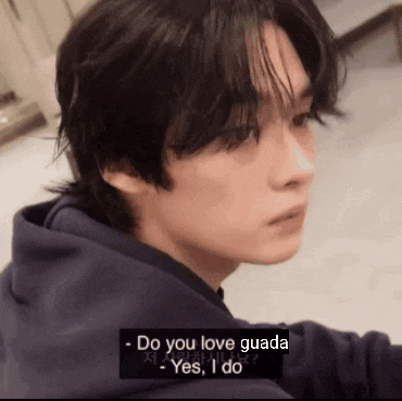 a close up of a person 's face with a caption that says `` do you love guada ''