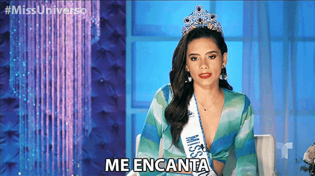 a woman wearing a crown and a sash that says miss universe