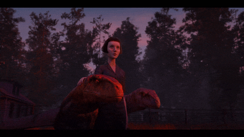 a woman standing next to two dinosaurs in a fenced in area