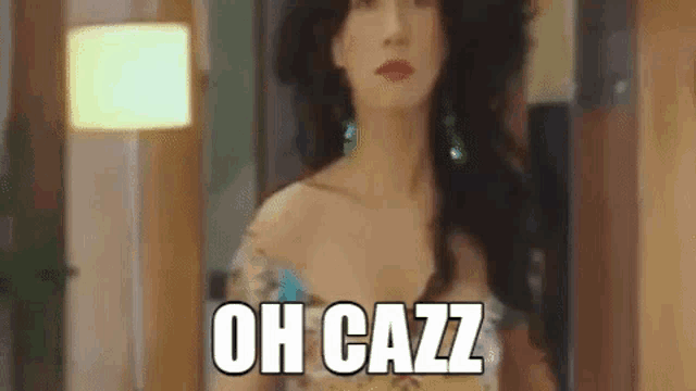 a woman in a wig is standing in front of a mirror .