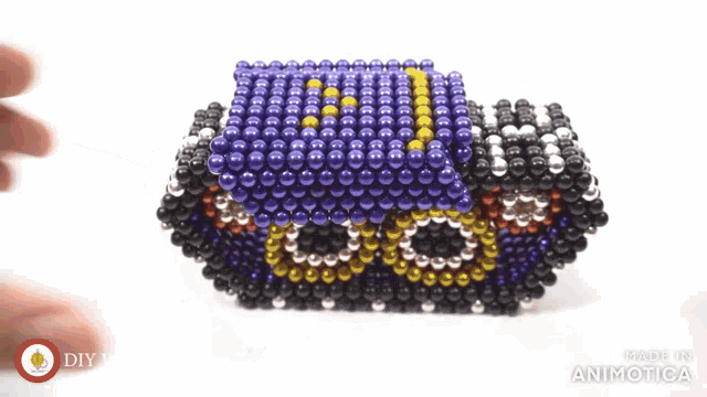 a toy made of beads that says made in animatica on it
