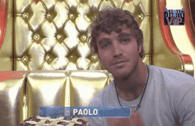 a man with the name paolo written on his shirt