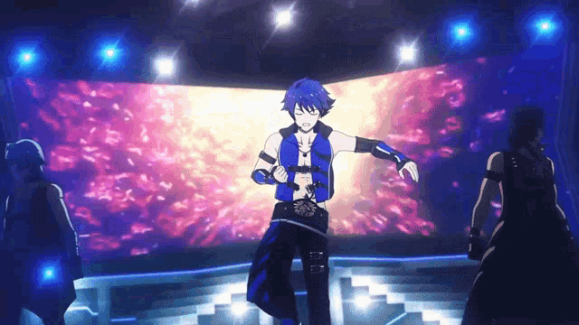 a man with blue hair is dancing in front of a large screen