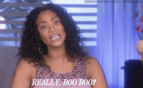 a woman says really boo boo in a purple dress