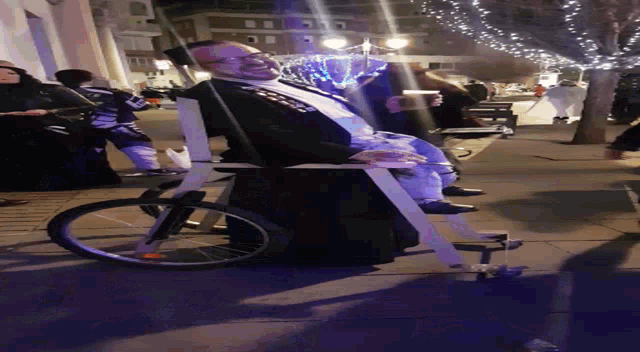 a person laying on a cart with a sticker on it that says ' a '