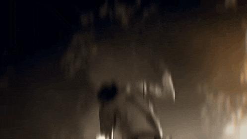 a blurry picture of a person in a dark room