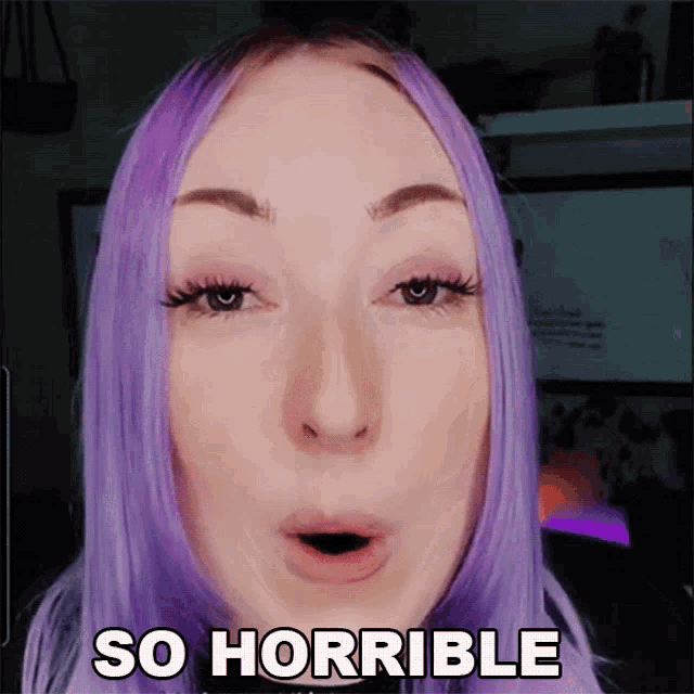 a woman with purple hair says so horrible in front of her face