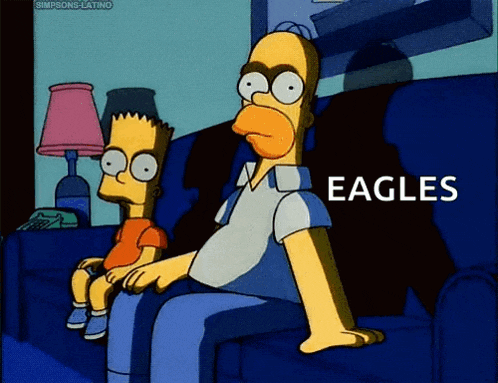 a cartoon of homer simpson and bart simpson sitting on a couch watching the eagles