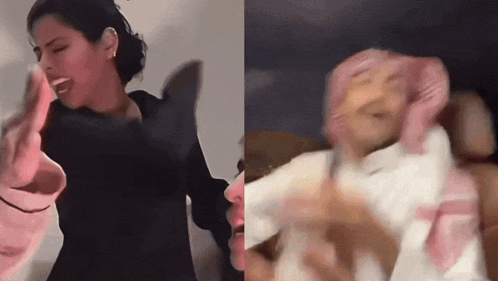 a woman in a black dress and a man in a pink scarf are dancing together