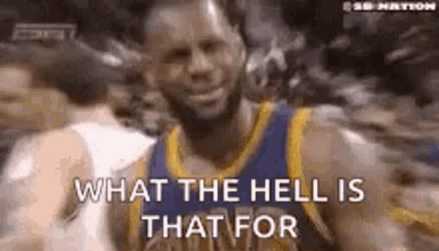 a basketball player is smiling while wearing a golden state warriors jersey and saying `` what the hell is that for '' .