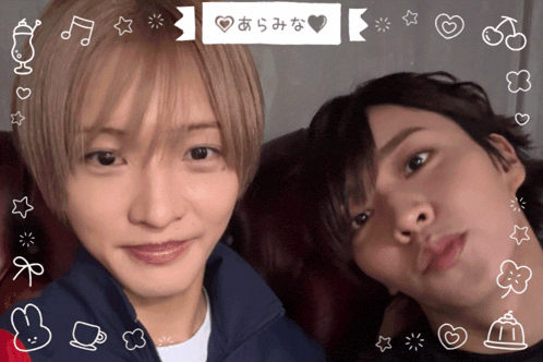 two young men are posing for a picture with a sticker that says ' a '