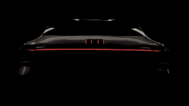 the audi logo is surrounded by sparkles on a dark background