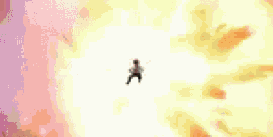a man is flying through the air in front of a huge explosion .