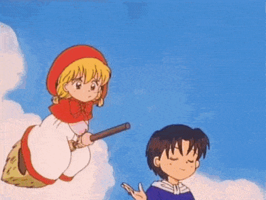 a boy and a girl are flying through the air on a broom .