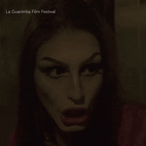 a close up of a woman with la guarimba film festival written below her