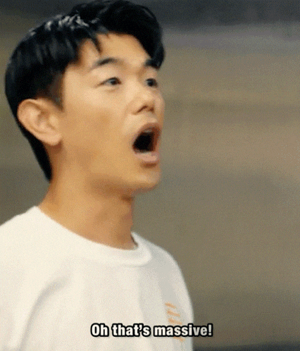 a man is making a funny face and saying `` oh that 's massive ! ''