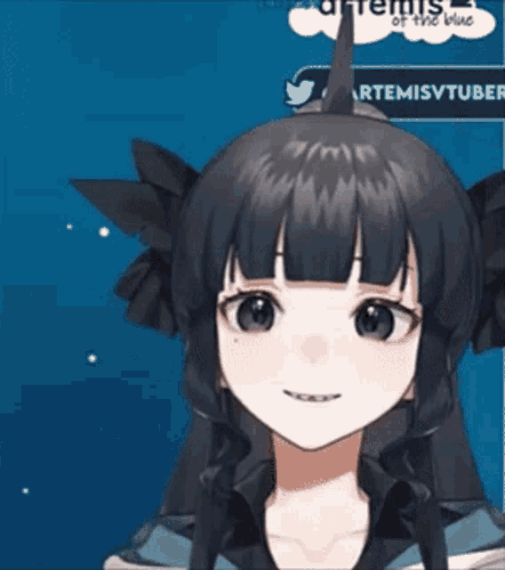 a girl with a horn on her head is smiling in front of a twitter logo