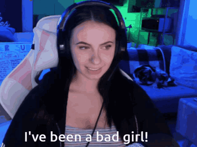 a woman wearing headphones with the words i 've been a bad girl below her