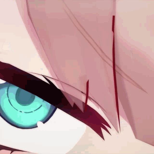 a close up of a person 's eye with blue eyes and red hair