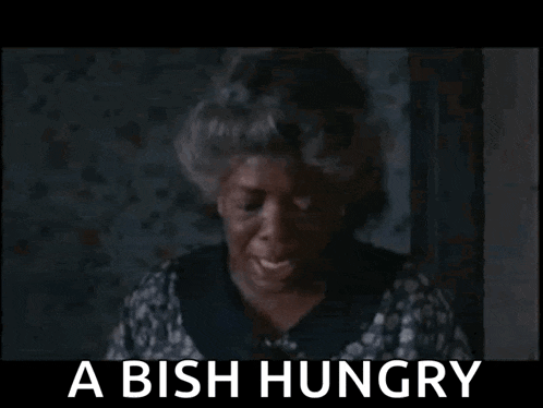 a woman is crying with the words " a bish hungry " above her