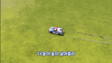 a cartoon car with korean writing on the side of it