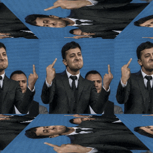 a man in a suit and tie is giving a middle finger