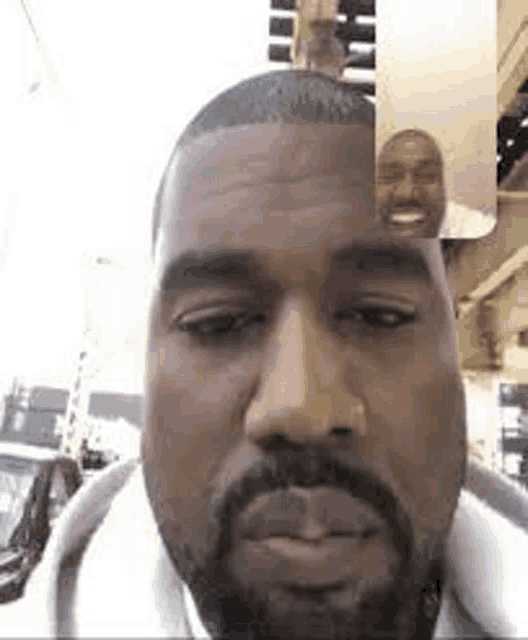 a man with a beard is having a video call with two other men .