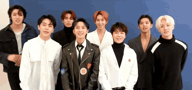a group of young men are posing for a photo
