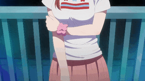 a girl wearing a white shirt with the letter b on the front