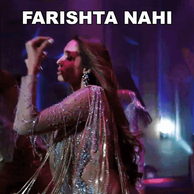 a woman is dancing in front of a sign that says farishta nahi