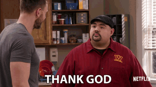 a man in a red shirt that says w on it