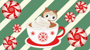 a cup of hot chocolate with whipped cream and candy canes