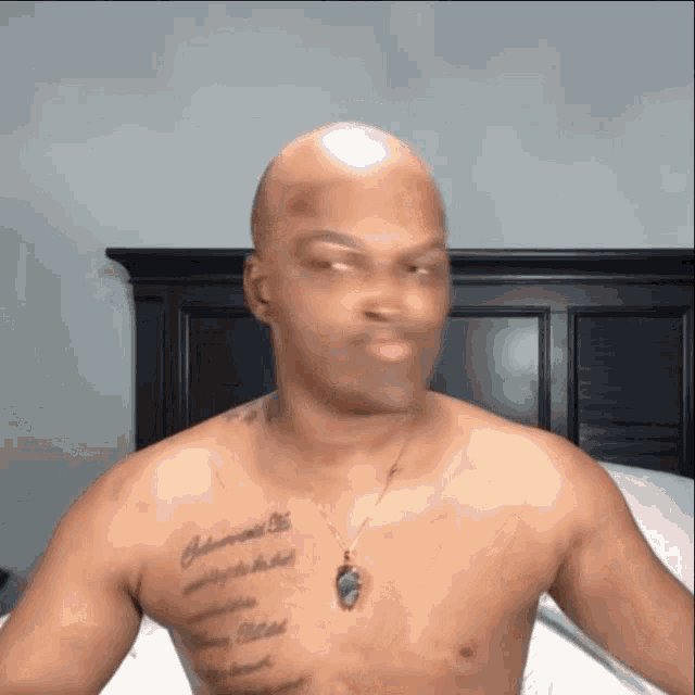 a shirtless man with a tattoo on his chest that says johnson on it