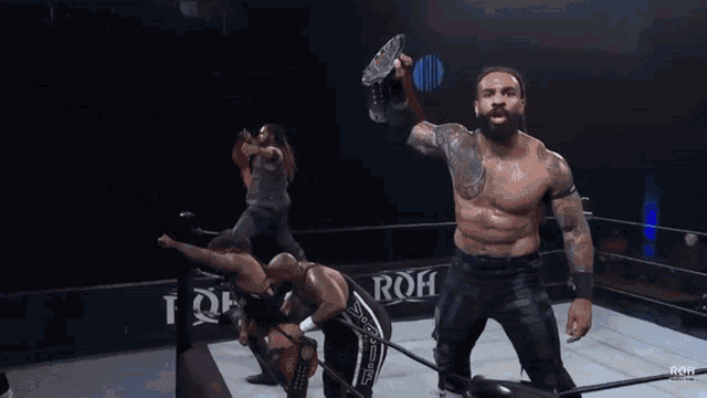a wrestler in a ring with the word roh on the side