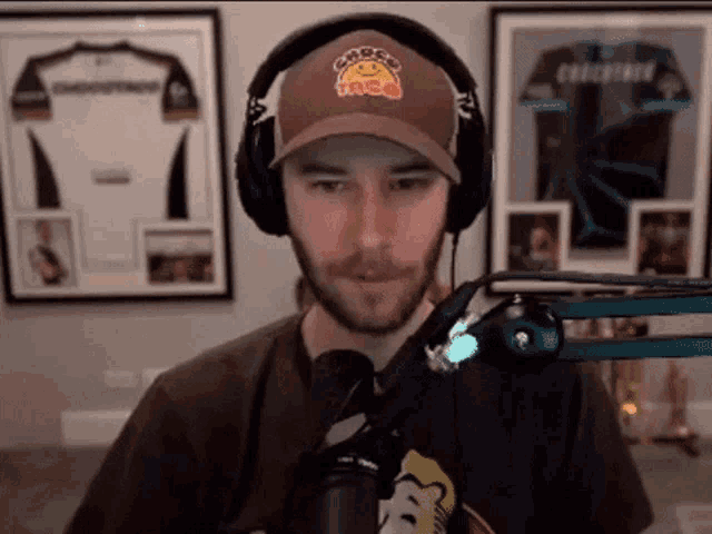 a man wearing headphones and a taco hat