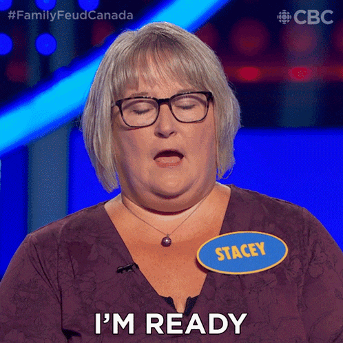 a woman with glasses and a name tag that says stacey is saying i 'm ready
