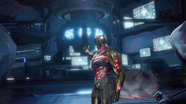 a man in a futuristic suit is standing in a room with a lot of monitors