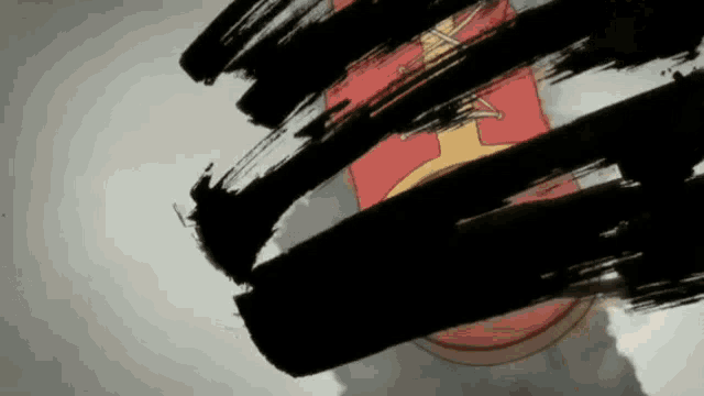 a close up of a brush stroke on a white background with a red and yellow object in the background .