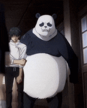 a panda bear is standing next to a man in a white shirt .
