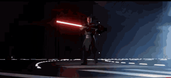 darth maul is holding a red lightsaber in his hand .