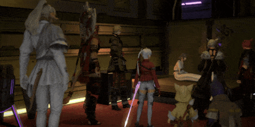 a group of people are standing in a room and one of them has a sword