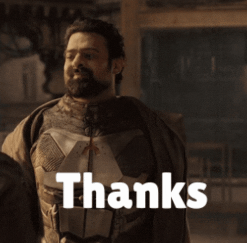 a man with a beard is smiling and the words thanks are visible